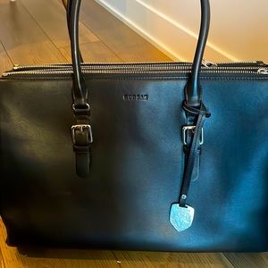 Genuine Leather Rudsak bag.